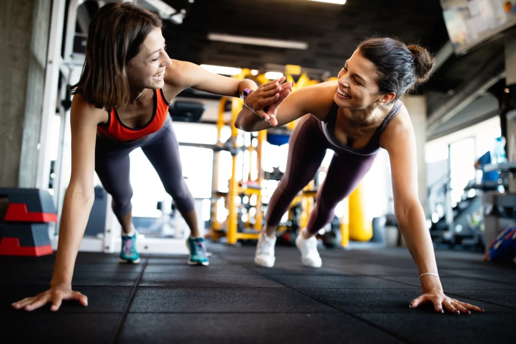 beautiful fit women working out in gym 2021 08 28 07 03 43 utc scaled 1 10 tips to help you stay motivated over winter! 7
