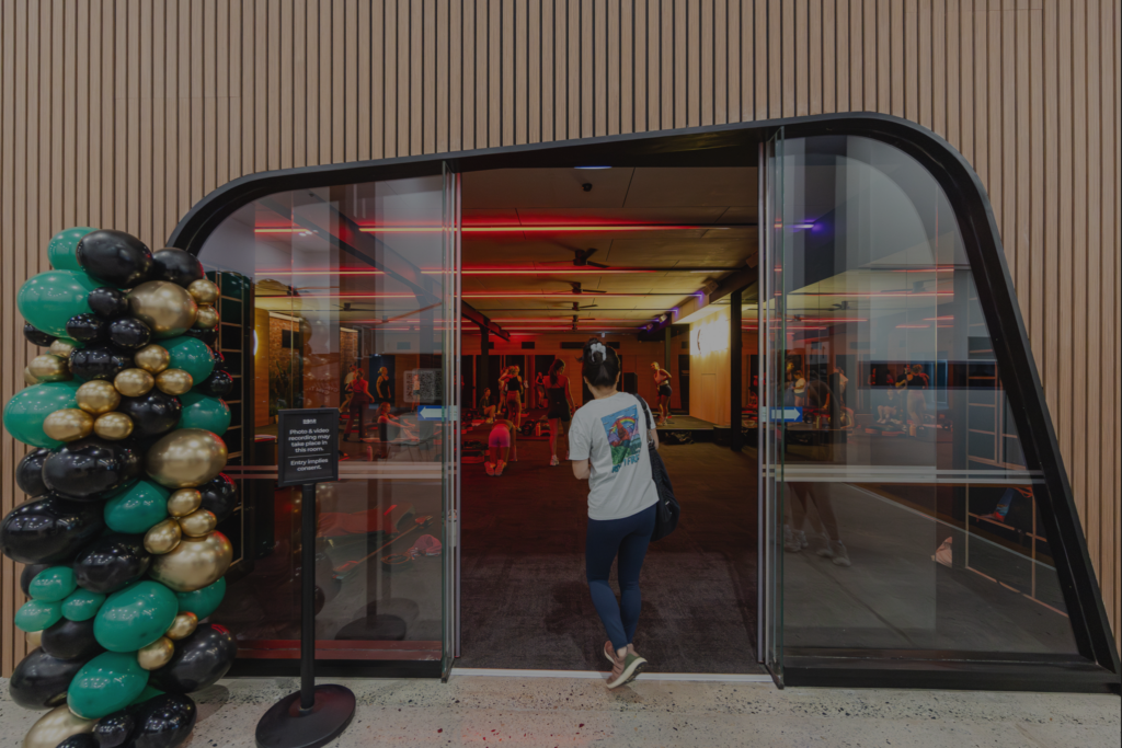 ROAR Active Open Day entrance with guest walking into a group fitness studio at the club
